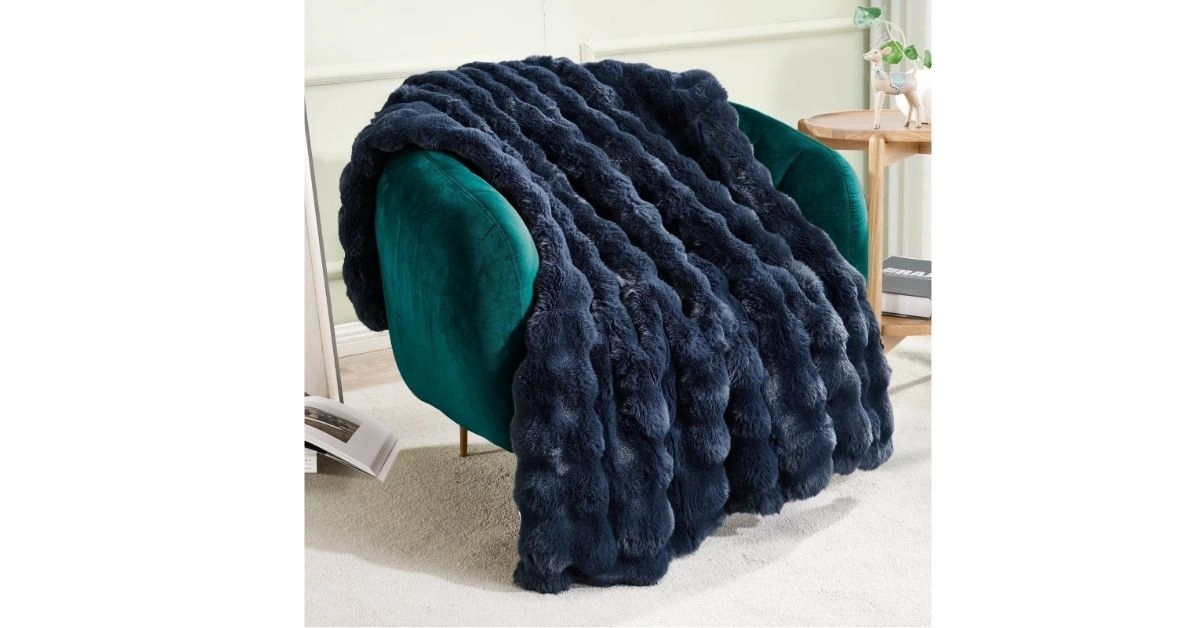 a woolen throw blanket for the bed