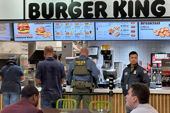 Moving government officials are seen at Hartsfield-Jackson Atlanta International Airport, Monday, March 23, 2026, in Atlanta. (AP Photo/Emilie Megnien)