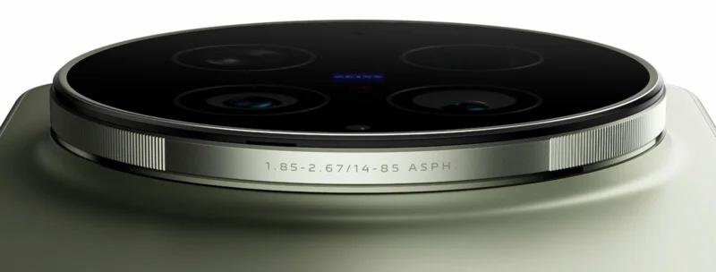 Next to the smartphone's four-lens camera module, the Zeiss logo, and lens specifications engraved on a metal ring, set against a smooth, matte surface.