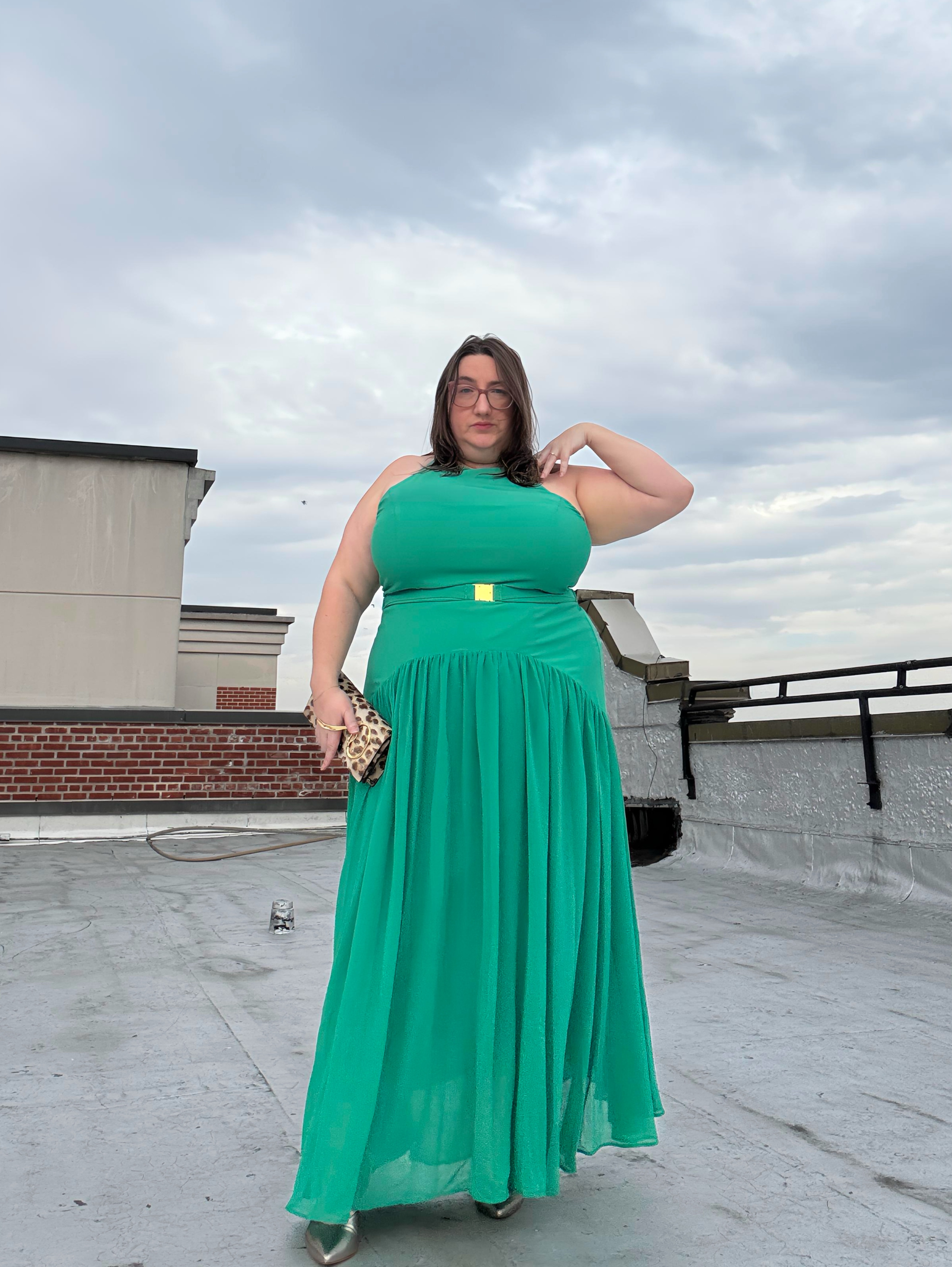 Sarah Chiwaya wore a mint green maxi dress with an animal print clutch